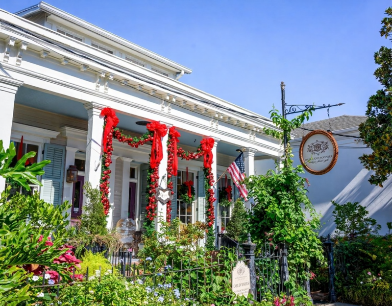 New Orleans Christmas, French Quarter balcony, holiday decorations, wrought iron, festive lights, evening, charming}
