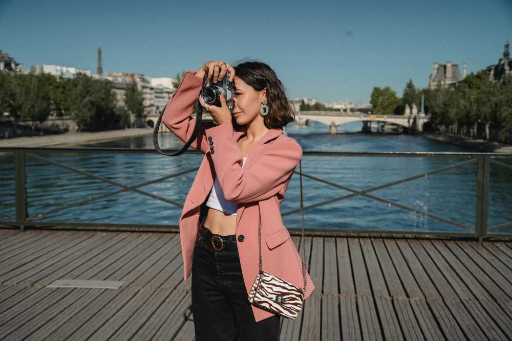 stylish woman, infinity pool, Santorini, Greece, caldera view, luxury hotel, serene, travel inspiration