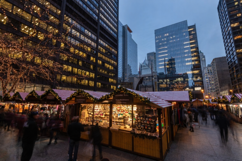 Christkindlmarket Glühwein mug, Chicago holiday market, steaming hot wine, souvenir boot mug, festive food, close-up}
