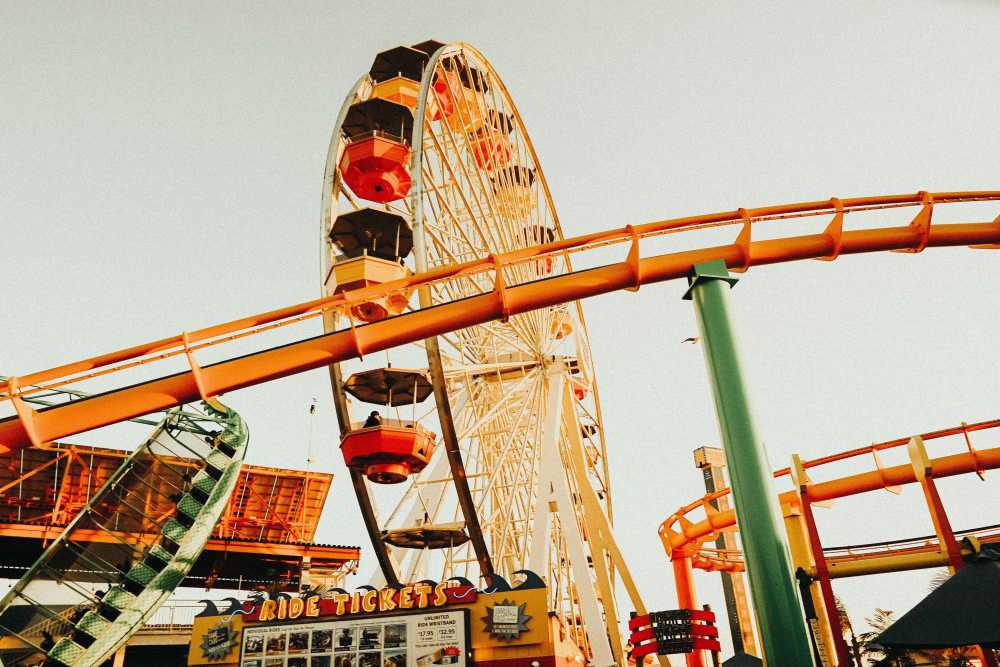 Santa Monica Pier, sunset, family silhouette, Ferris wheel, Southern California, vibrant colors, iconic