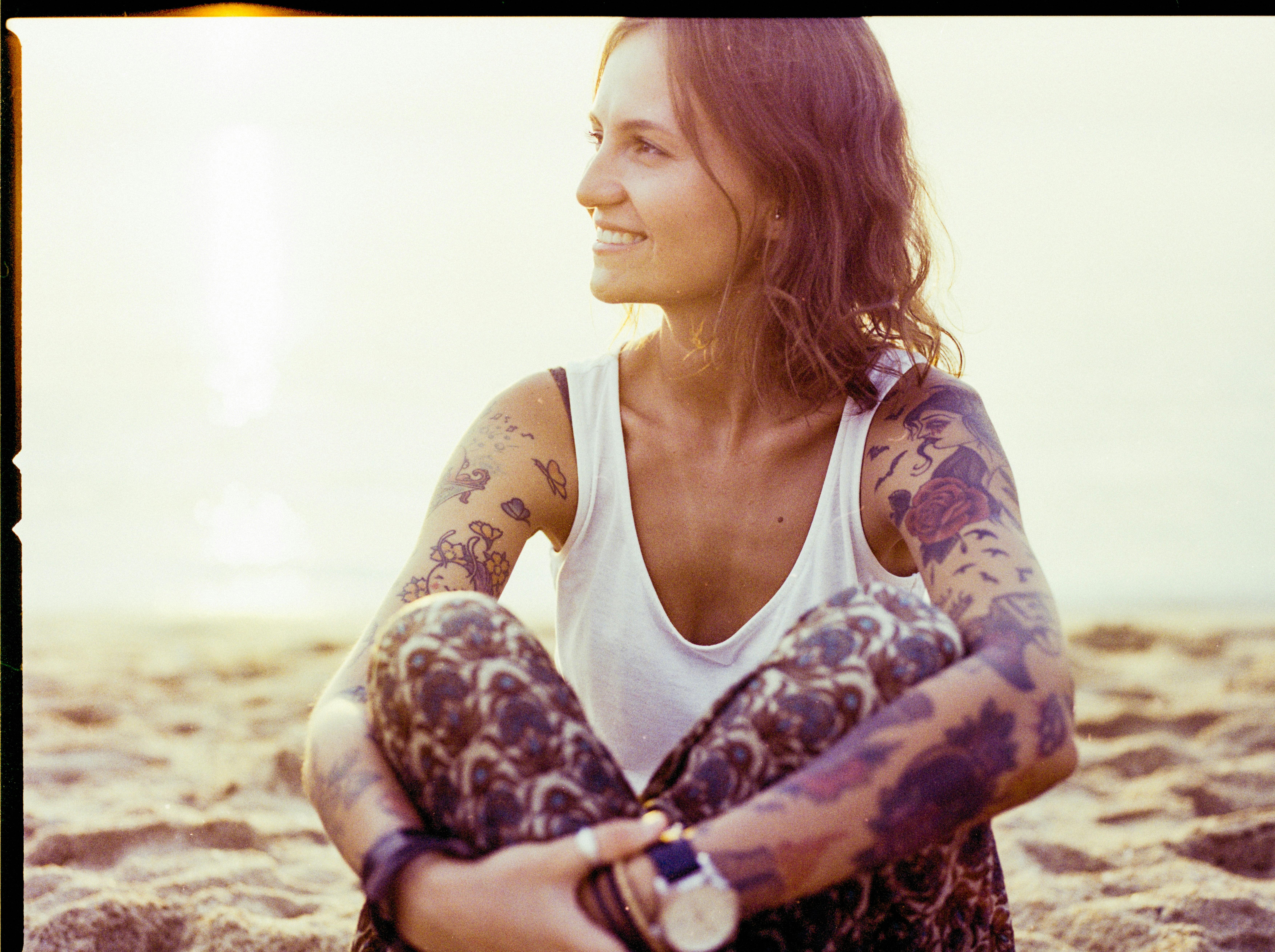 solo female traveler, mountain summit, sunrise, backpack, looking at view, freedom, empowerment}