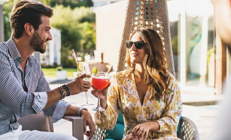 kids on water slide, family adventure, serene beach cabana, couple relaxing, jungle hike, family kayaking, resort activities