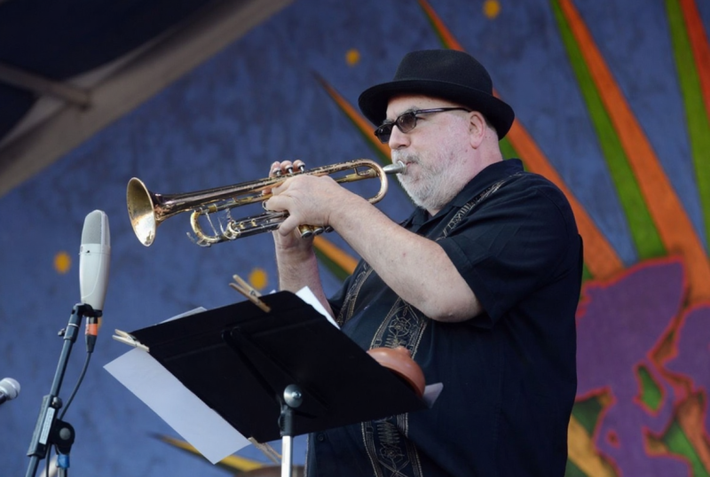 Jazz Fest food, Crawfish Monica, Louisiana cuisine, festival food stall, colorful dishes, New Orleans food, happy people eating}