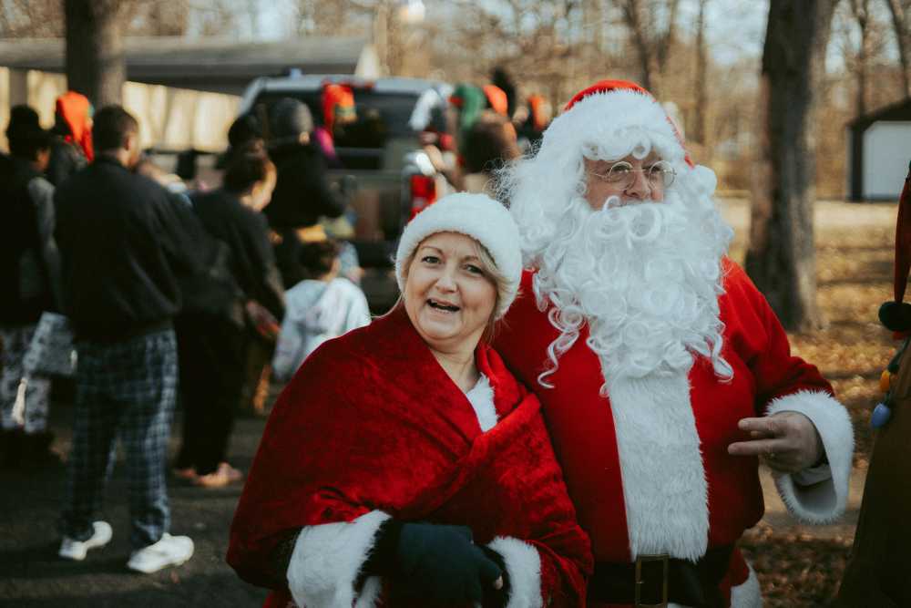 Caroling in Jackson Square, New Orleans, St. Louis Cathedral, candlelight vigil, community gathering, Christmas carols, holiday spirit}