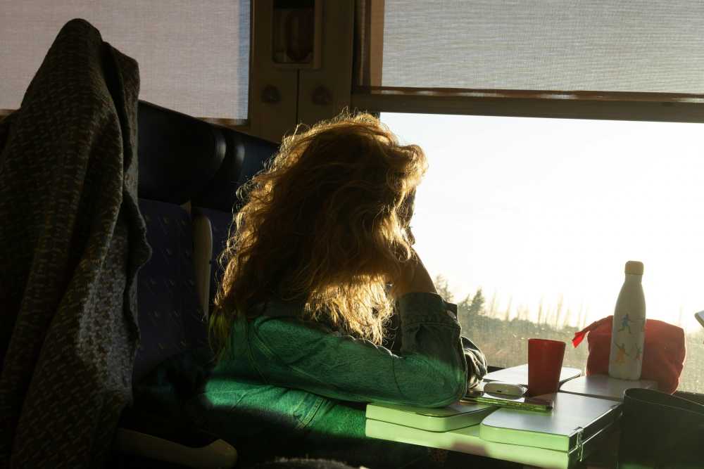 solo female traveler, city street, looking around, situational awareness, confident posture, urban exploration, safe travel