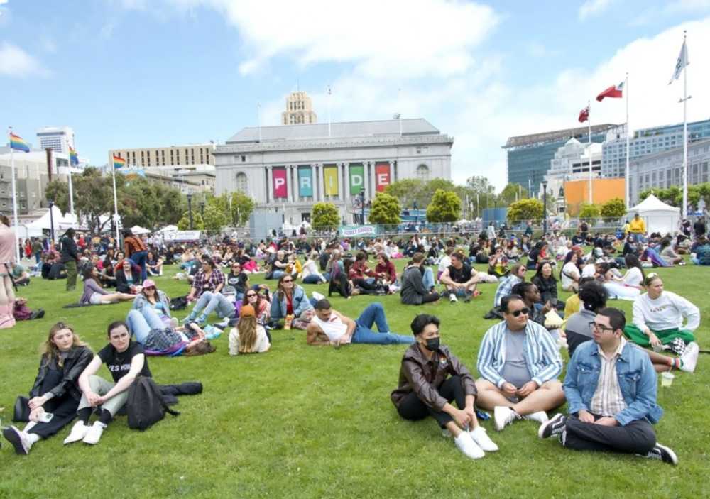 SF Pride festival, Civic Center Plaza, live music stage, crowd dancing, community booths, San Francisco City Hall}