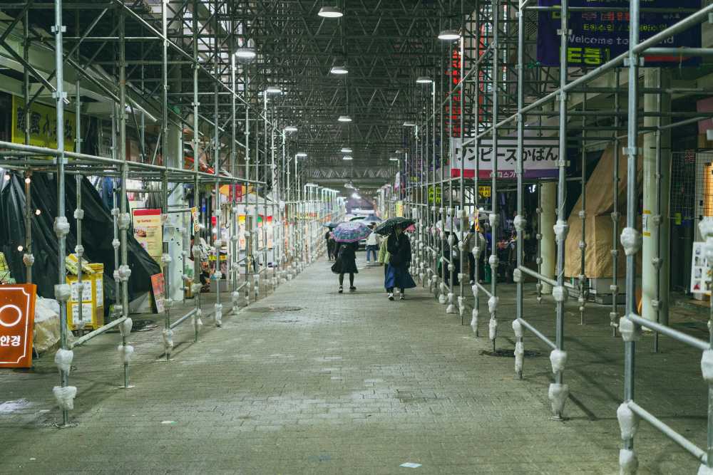 solo female traveler, confident, smiling, city backdrop, backpack, empowerment, independent woman