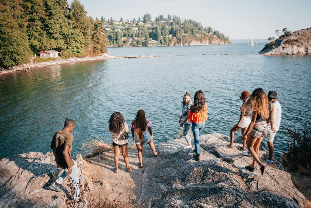 kayaking, Emerald Bay Lake Tahoe, family adventure, clear turquoise water, mountains, sunny day, active lifestyle