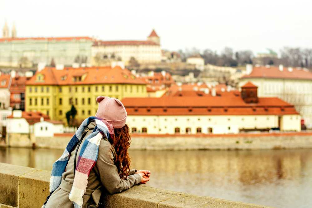 woman with backpack, walking down charming European street, cobblestone, adventure awaits, looking forward, freedom